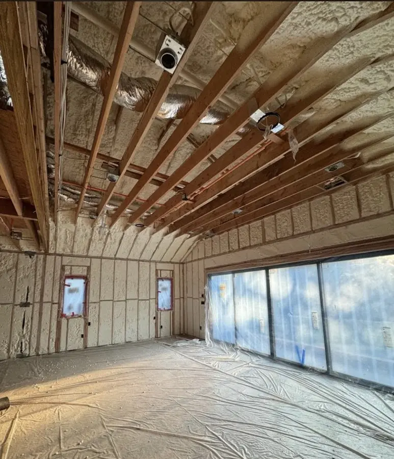 Interior walls and ceiling insulated with spray foam during new construction in Stillwater